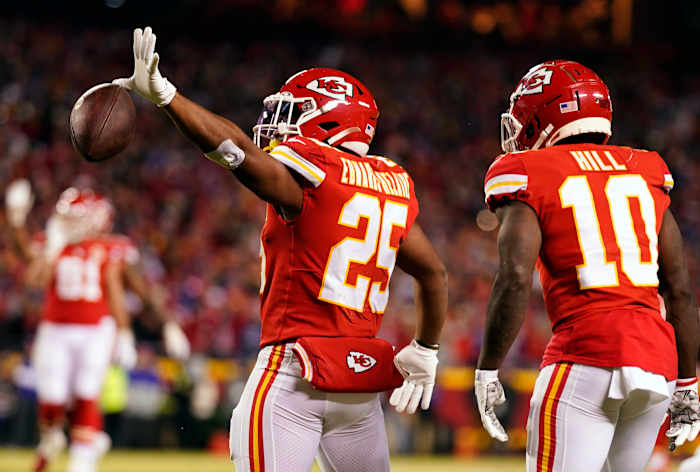 Jan 23, 2022; Kansas City, Missouri, USA; Kansas City Chiefs running back Clyde Edwards-Helaire (25) reacts with the ball against the Buffalo Bills during the first half in the AFC Divisional playoff football game at GEHA Field at Arrowhead Stadium. Mandatory Credit: Jay Biggerstaff-USA TODAY Sports